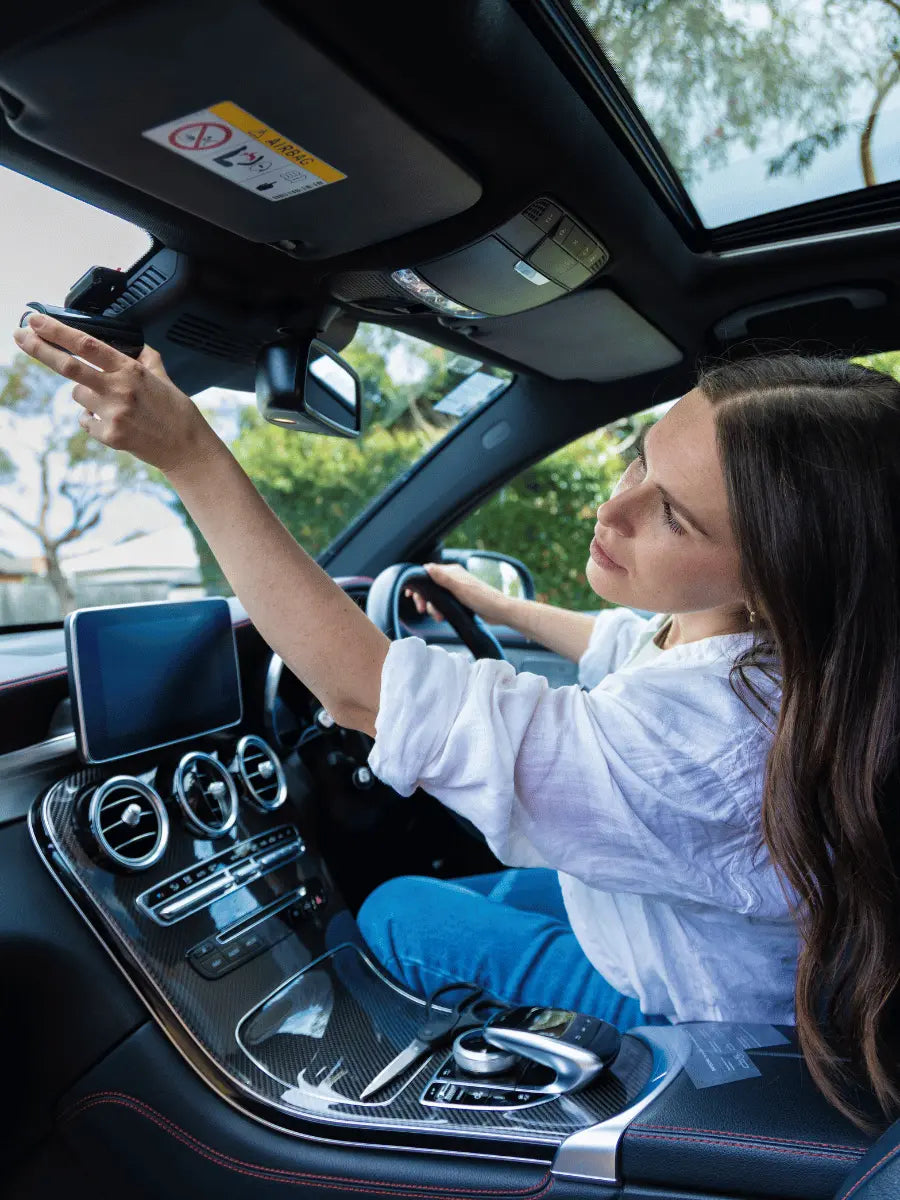 DriveVision 4K DashCam - Australia's best dashcam, showcasing someone mounting the dash cam to the windscreen